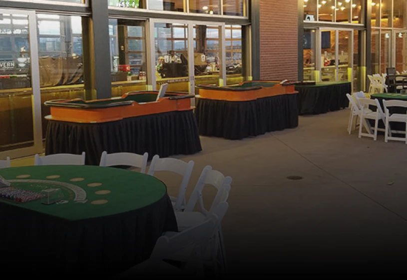 Casino tables set up for outdoor event.