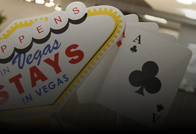 Vegas sign with ace of clubs card.