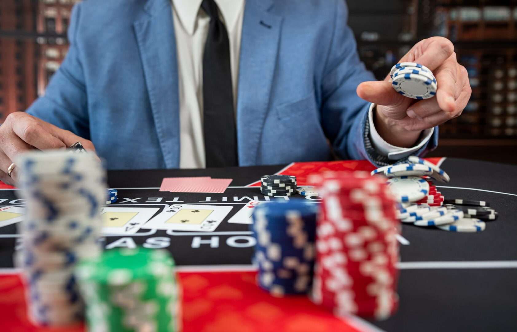 Casino player organizing poker chips