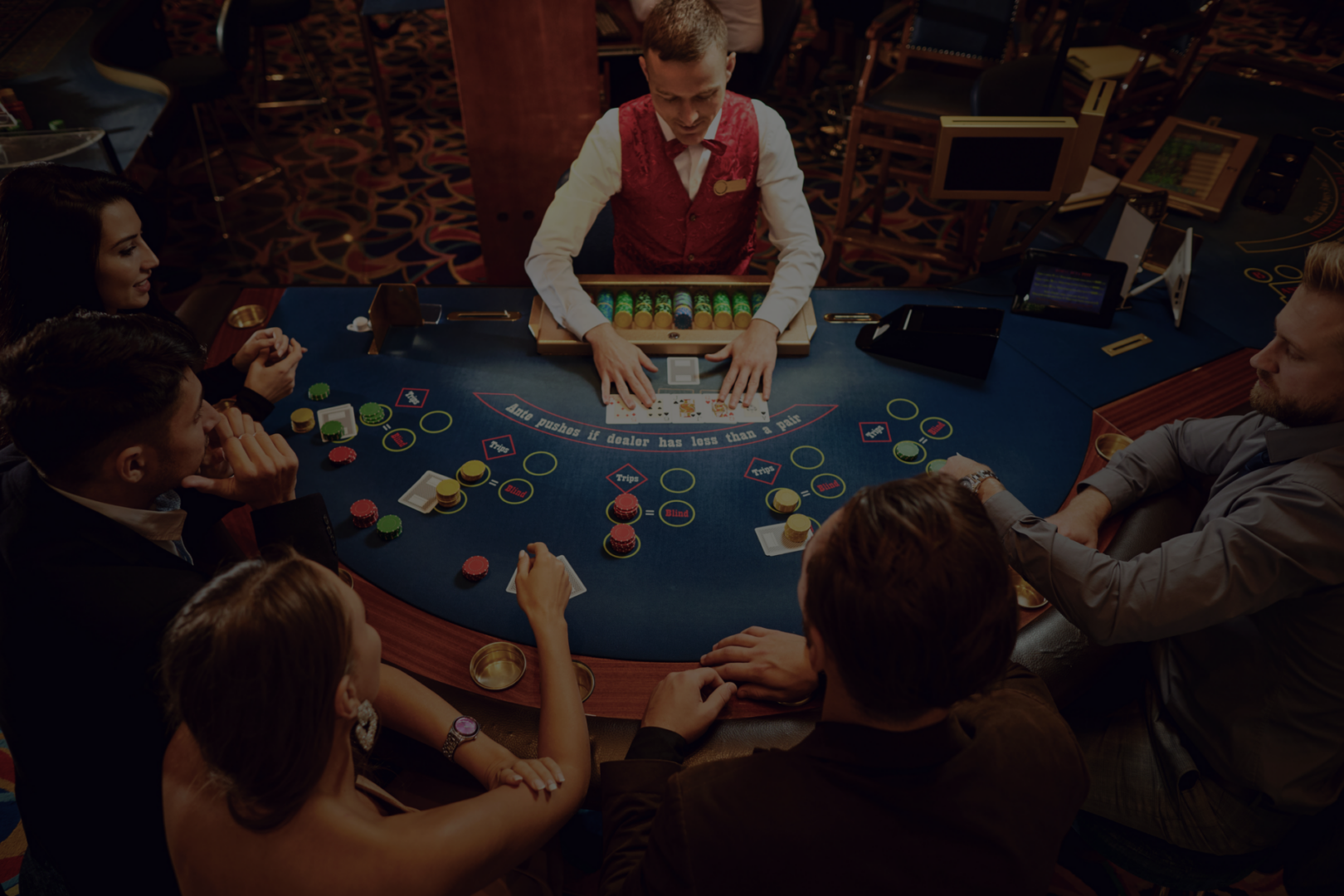 Group playing blackjack in casino