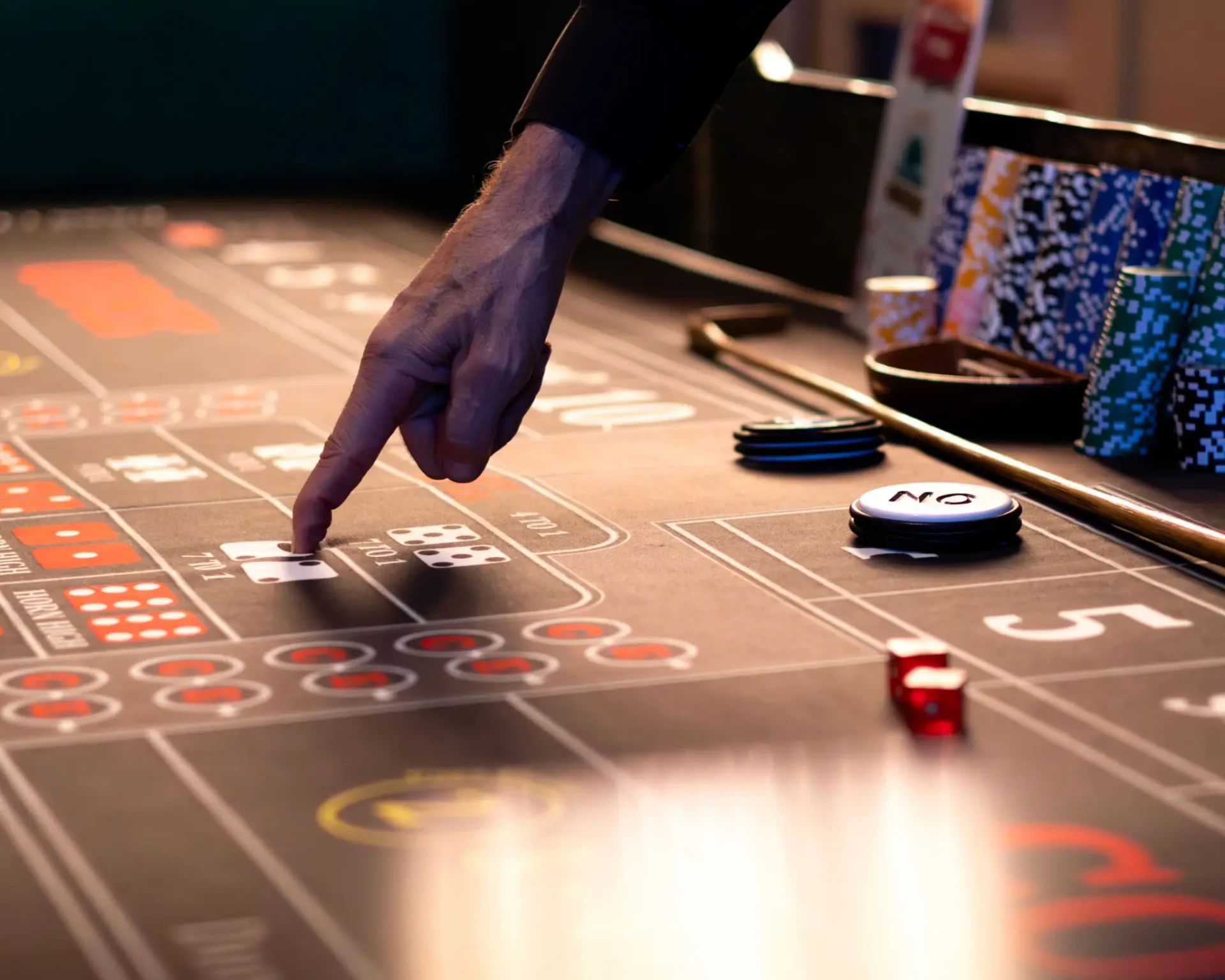 Hand pointing at casino table layout
