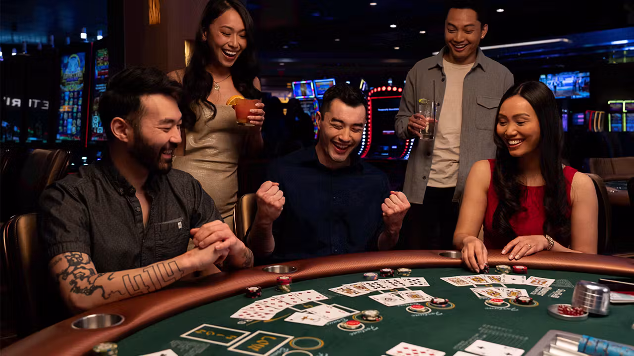 Friends celebrating a win at casino table